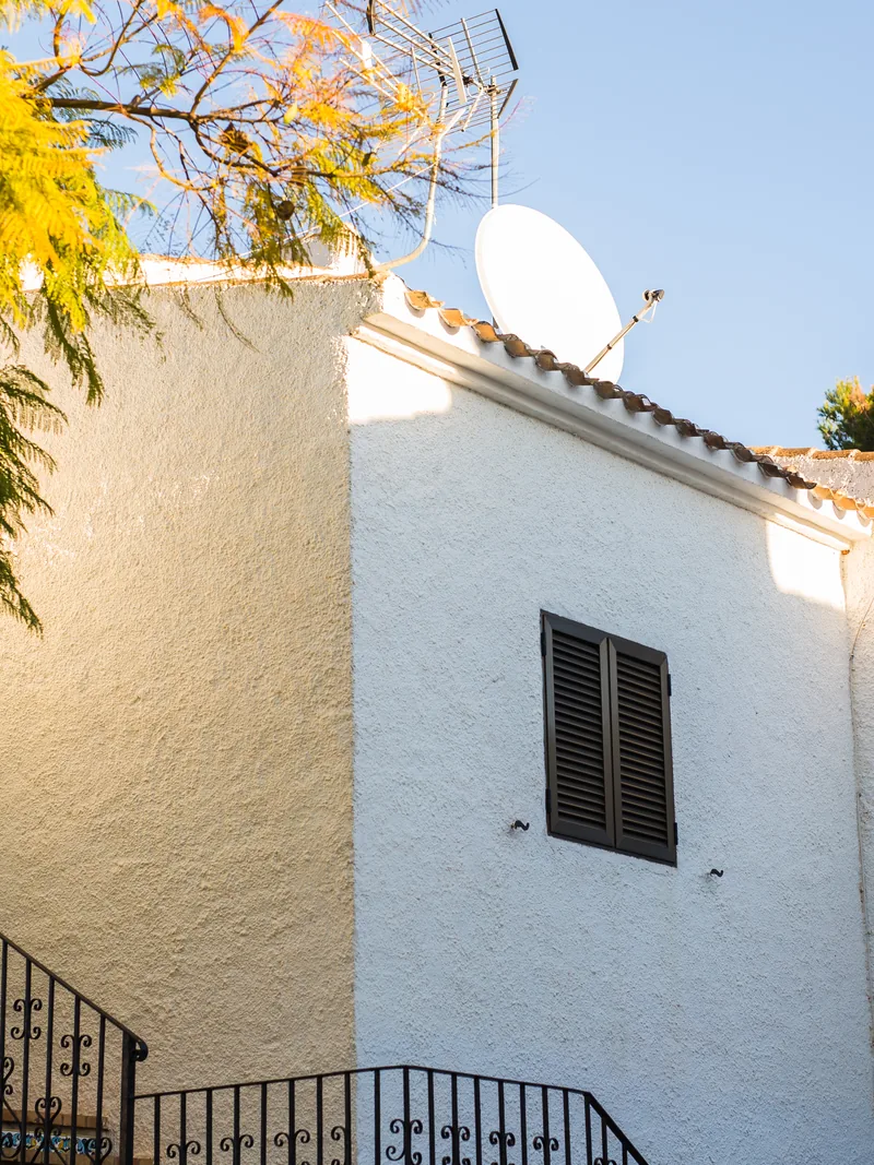 Renewed white stucco home exterior