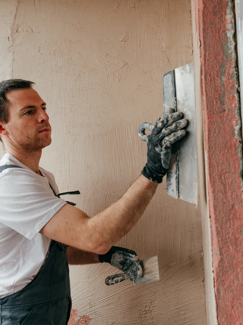Applying interior plaster inside a home